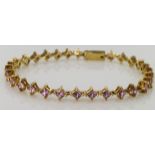 18ct Gold hallmarked Pink Sapphire set Tennis style Bracelet weight 14.1g