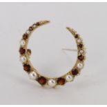9ct crescent brooch set with garnet and pearl, weight 3.8g