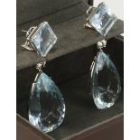 18ct white gold drop earrings set with offset square step cut aquamarines measuring approx. 13mm x