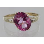 9ct yellow gold pink topaz oval ring with diamond accents, finger size P, weight 1.8g