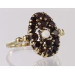 9ct dress ring set with garnet and pearl, finger size U, weight 4.7g
