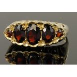 9ct yellow gold graduated five stone garnet ring, finger size O, weight 4.1g