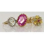 Three 9ct yellow gold mixed gemstone rings, gems include topaz, peridot, quartz and diamond,