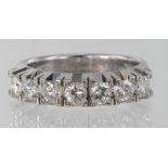 18ct white gold half eternity ring set with seven diamonds totalling 1ct, finger size M, weight 5.