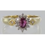 18ct yellow gold pink sapphire and diamond cluster ring with diamond shoulder detail, finger size N,