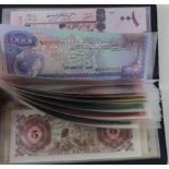 World (22) in small Leuchturm Banknote album, including Korea 50,000 Won (2009), Macau 5 Patacas (