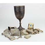 Mixed silver. A collection of hallmarked silver, including a trophy, cigarette cases, vesta cases,