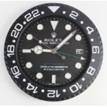 Advertising Wall Clock. Black 'Rolex' advertising wall clock, black dial reads 'Rolex Oyster