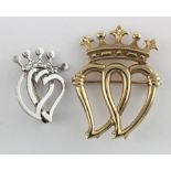 Two Luckenbooth double heart brooches, the first 9ct. Gold hallmarked for Edinburgh. 1983 (Weighs