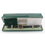 Gold plated ?. Mid-size Gucci wristwatch,the back of the case marked 3000.2.M. Boxed with paperwork,