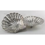 Two ornate silver butter dishes, both on three ball feet, hallmarked 'H.A. Sheffields, 1896'.