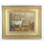 Picture. A decorative picture depicting a white horse stood next to a tree, contained in a gilt