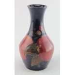 Moorcroft. Small Moorcroft vase, depicting pomegranate & berries, circa early 20th Century, makers
