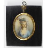 Portrait miniature, depicting a lady wearing a blue dress, with a large feather in her hat, signed