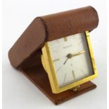 Jaeger LeCoultre travel clock, contained in a leather case, diameter 70mm approx. (working at time