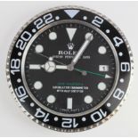 Advertising Wall Clock. Black & chrome 'Rolex' advertising wall clock, black dial reads 'Rolex