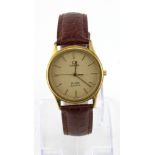 Gents gold plated Omega Deville quartz wristwatch. The gold dial with gilt baton markers. On an