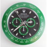 Advertising Wall Clock. Green 'Rolex' advertising wall clock, black dial reads 'Rolex Oyster