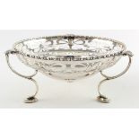 Silver open-work bowl on three feet, hallmarked Sheffield 1912. Weighs 11.25oz.