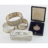 Pair of silver napkin rings, silver topped glass jar, silver bangle and silver boxed school