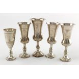 Five silver Jewish related Kiddush cups, various sizes and hallmarks, hallmarks being 'J.Z., Chester