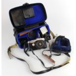 Olympus Pen F camera, in original case, with two other lenses, accessories etc.