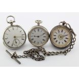 Three mid-size silver cased open face pocket watches (not working) along with a silver "T" bar