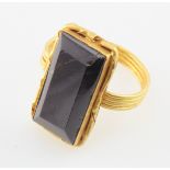 Medieval gold ring (tests as high carat) with a large rectangular stone (cracked).