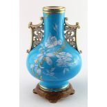 Minton baluster vase with intricate gilt handles, pale blue with hand painted floral decoration