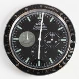 Advertising Wall Clock. Black & chrome 'Omega' advertising wall clock, black dial reads 'Omega