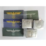 German WW2 RZM aluminium belt buckles with four unused German breast Eagles.