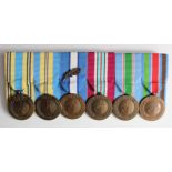 United Nations Service Medals all different campaigns mounted for wearing. (6)