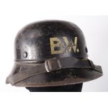 German Nazi Civil Defence helmet with liner and chinstrap, named inside to 'v. Loon' and stamped '