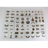 Shoulder Title collection on white cards, plus a card of lapel badges, and a few cap badges and