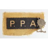 Badges a Popskis Private Army beret badge, locally sand cast made and a P.P.A cloth shoulder title.
