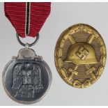 German WW2 Russian Front Medal, with a Wounds Badge. (2)