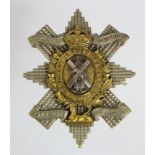 Cap badge - 9th Bn H.L.I. The Glasgow Highlanders. KC. A nice good quality badge