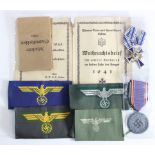 German Mothers Cross in bronze together with a Luftschutz medal, various cloth badges and booklet