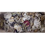 Cap Badges - large unsorted collection of mostly British, metal cap badges and a few collars. (