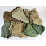 Assorted uniform lot. Items noted include a wartime dated Jungle Green and Khaki Drill items. (10