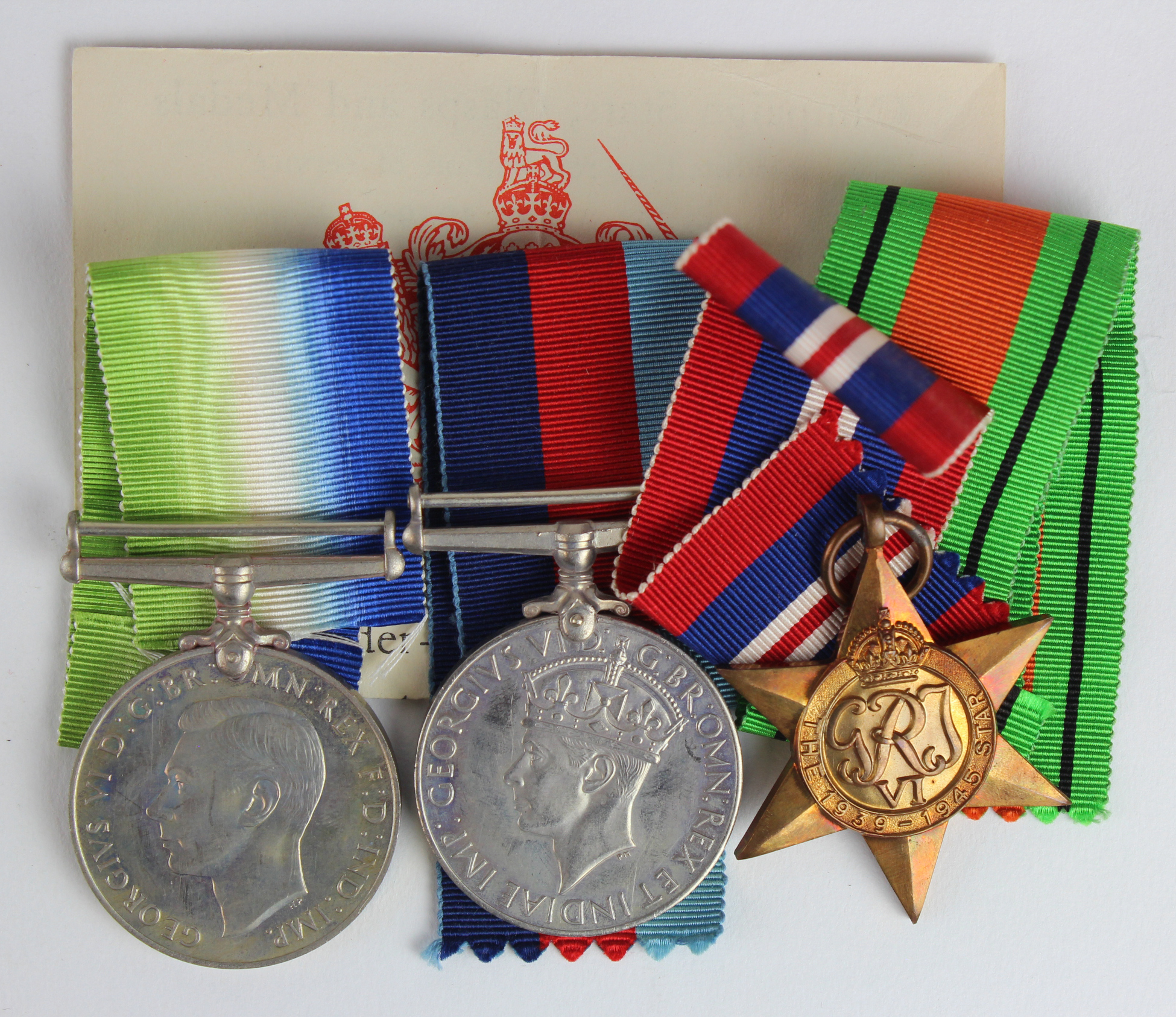 WW2 RAF medals in box of issue (most of address label removed). 1939-45 Star, Defence & War Medal.