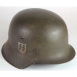 German raw edge Waffen SS steel helmet complete with liner, named to interior, minor rusting.