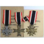 German War Merit Cross with Swords x2, one maker marked '15', and one with packet of issue. Plus War