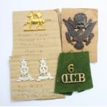 Badges - 1918 bronze US Army Officers cap badge, gilt Queens W.Surrey beret badge (1949-61),