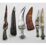 Eastern Daggers - an attractive lot of three Arab Jambiya Daggers in their scabbards and an Indian