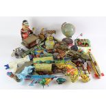 Tinplate toys. A collection of approximately twenty-five original and reproduction tinplate toys,