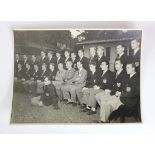 England 1951 (9"x7") b&w photo showing Team & Officials in blazers seated outside hotel prior to the