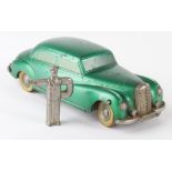 Prameta Mercedes Benz 300 green clockwork toy, with original key depicting a chauffeur, in need of