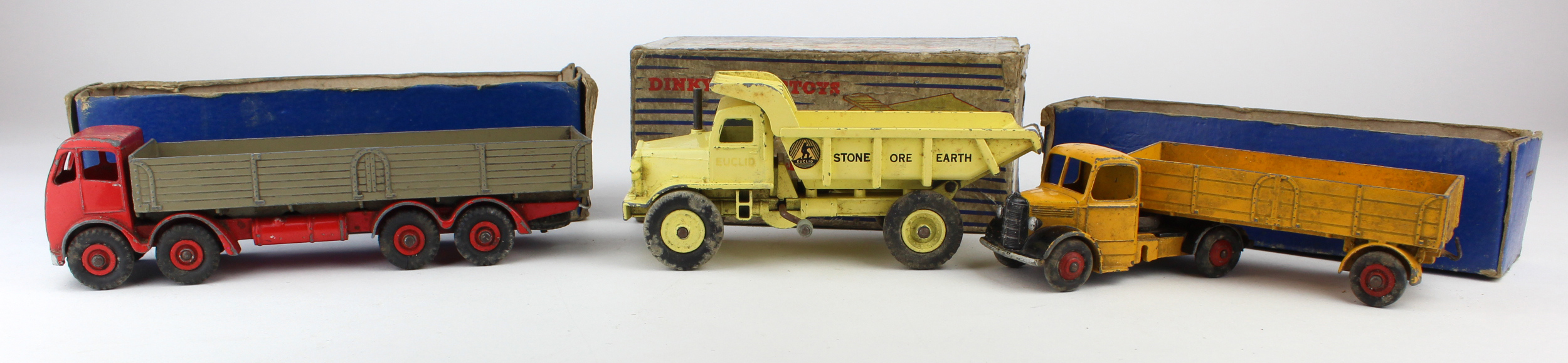 Dinky Toys. A group of three Dinky toys, comprising Foden lorry (red & grey); Bedford lorry (yellow)