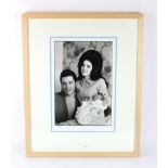 Elvis Presley & Priscilla Presley, 10 x 16" photograph, holding a very young Lisa Marie, taken
